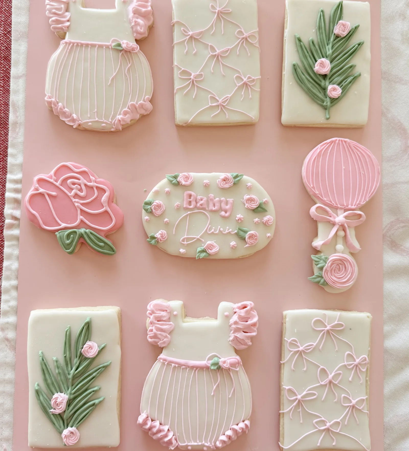 Baby shower rompers, roses & rattles